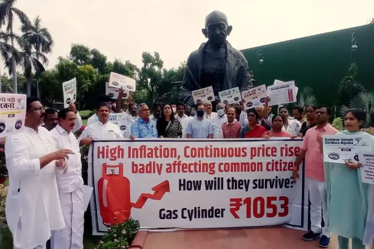 Opposition MPs in front of Gandhi statue in Parliament