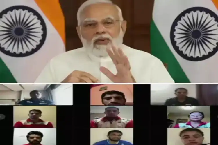 PM Modi interacting with the CWG bound athletes