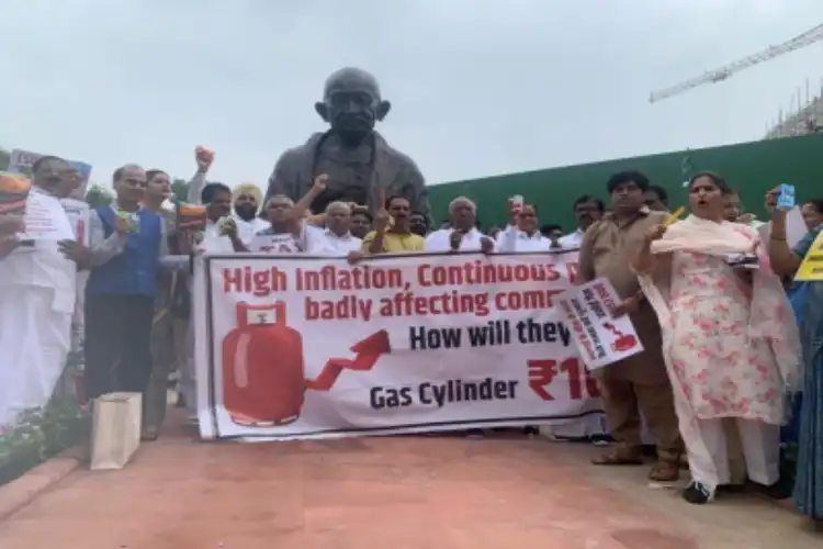 Opposition MPs in front of Gandhi statue in Parliament