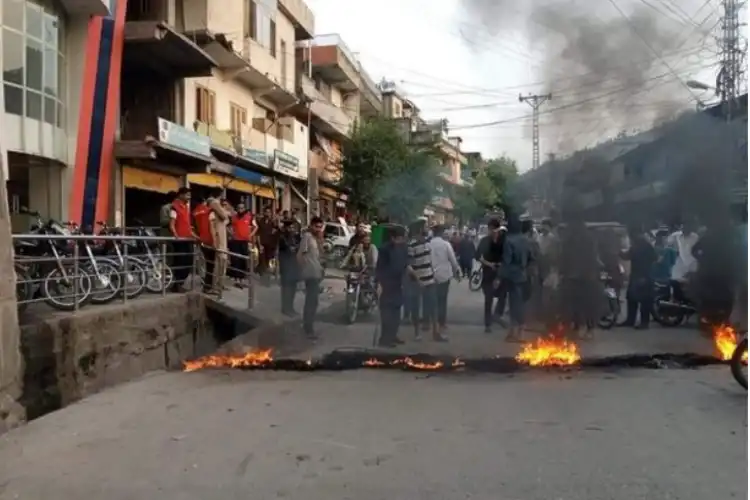 Youth burning tyres in PaaGali area of Poonch (Pakistan occupied Kashmir)