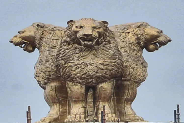 A view of the newly installed emblem atop new Parliament building