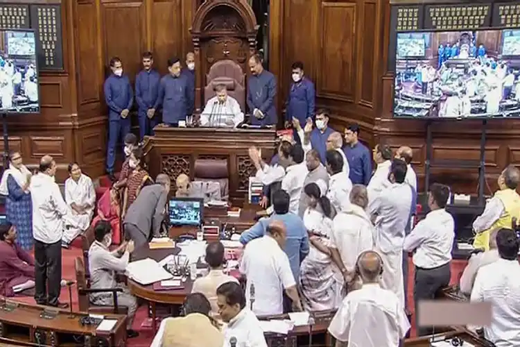 Opposition MPs protesting in the Well of Rajya Sabha