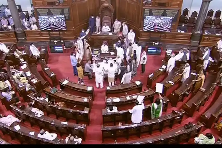 Opposition MPs protesting in the Well of Rajya Sabha