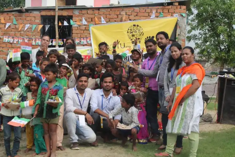 Mohd. Arif of The Chotu Foundation with children