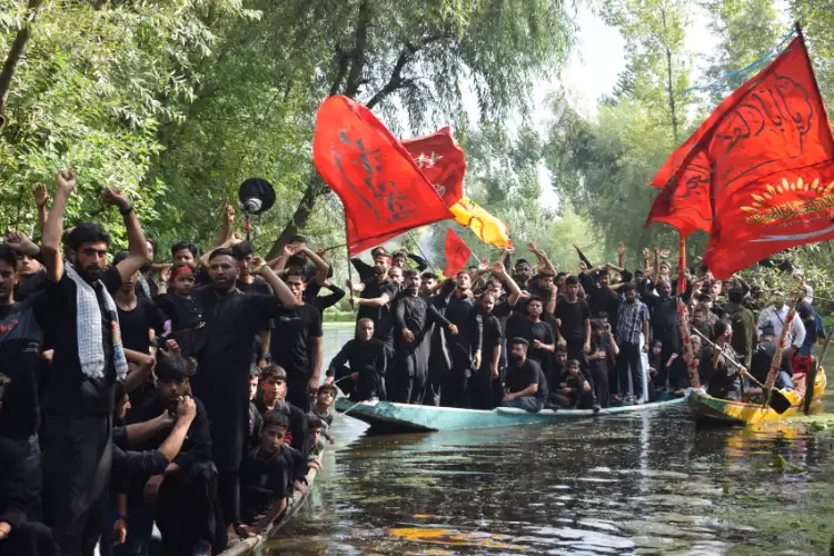 Shia mourners take out Muharram procession through interiors of Dal Lake in Srinagar, Kashmir on the 9th Muharram ( Pics: Basit Zargar)