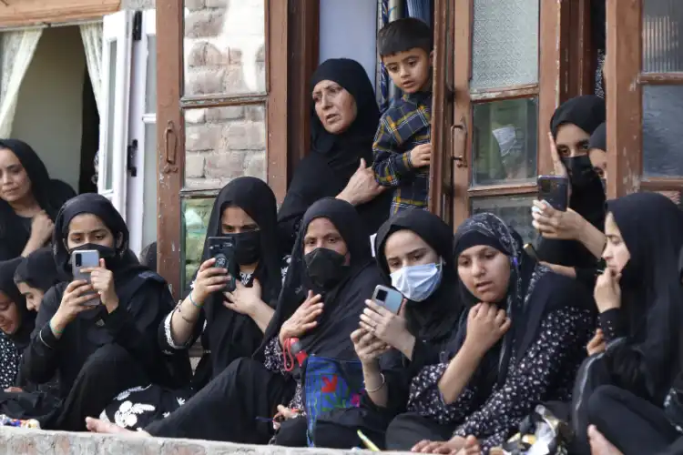 Kashmiri Muslim women mourners looking at the Ashura procession (Pics By: Basit Zargar)