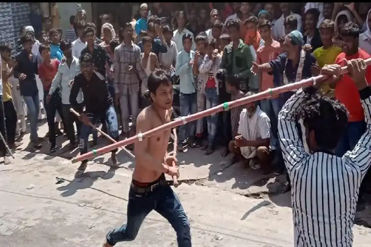 A Hindu youth displaying his skills during Muharram procession in Dholpur