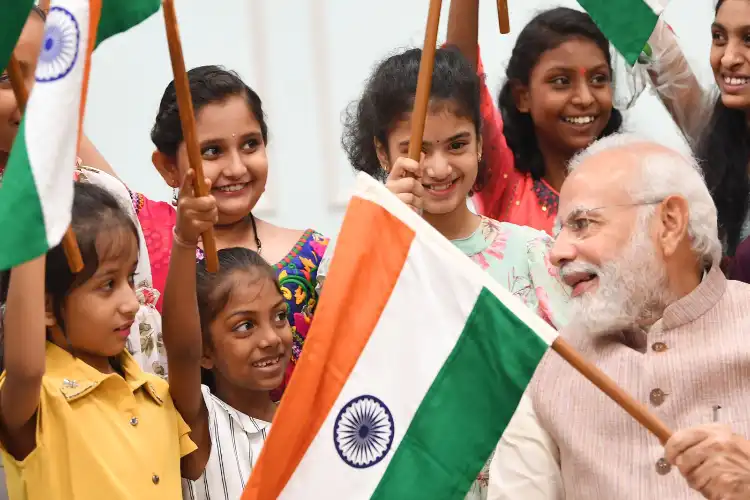 Prime Minister Narendra Modi with children celebrating Har Ghar Tiranga