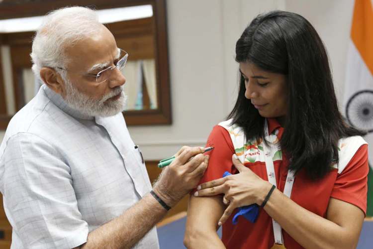 File picture of PM Modi signing Nikhat Zareen's T-shirt