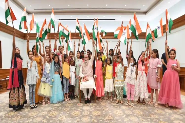 Prime Minister Narendra Modi with young girls promoting Har Ghar Tiranga campaign on 75 years of Independence