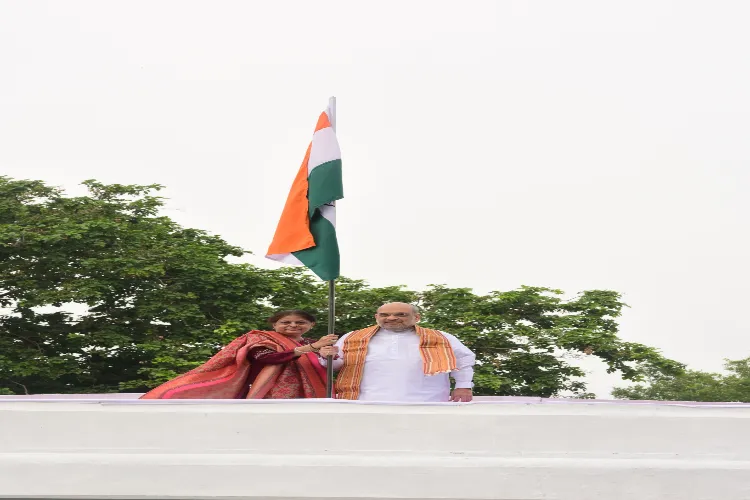 Amit Shah hoisting the national flag at his residence