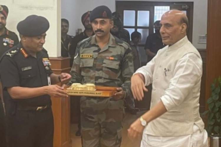 Defence Minister Rajnath Singh handing over indigenously built weapons to the army