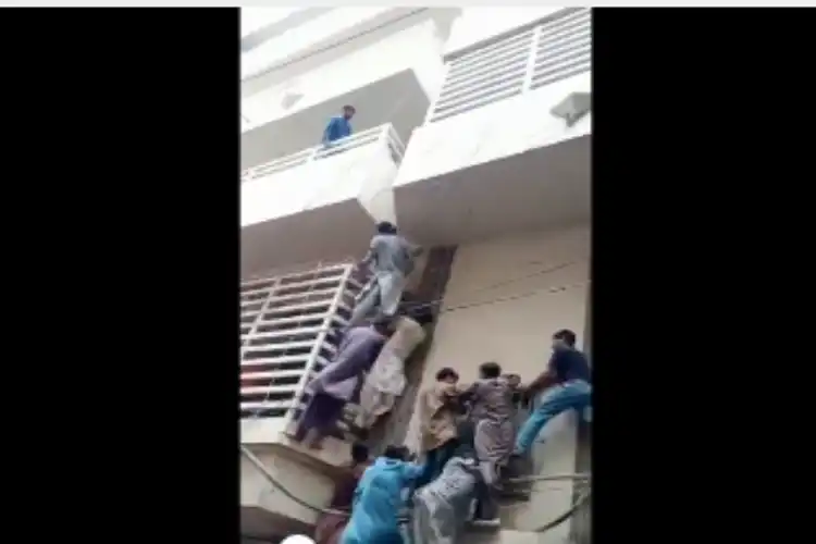 Ashok Kumar being chased by a mob as he tried to save his life (A video grab courtesy Twitter) Twitter)