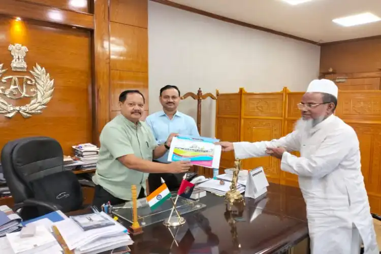 Moulana Abdul Quadir Quasimi, All Assam Tanzim Madaris Qawmiya, handing over a dictionary of Madrasas in Assam to DG Police Bhaskar Jyoti Mahanta (Assam Police Twitter)