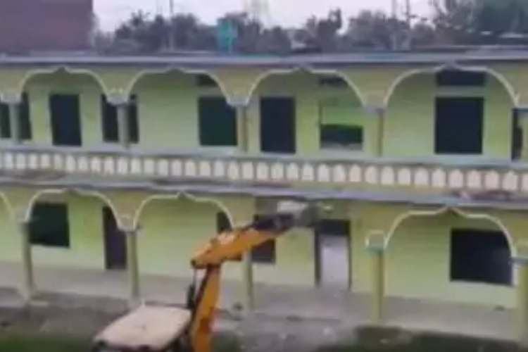 The Madrassa being razed