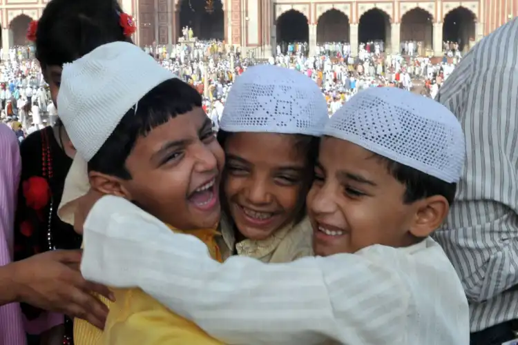 Muslim children embraced in a bond of friendship and love (Image: Ravi Batra)