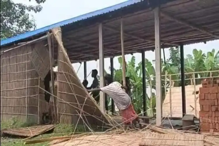 Local resident demolising a Madrassa in Golpada district (Twitter: Assam Police)