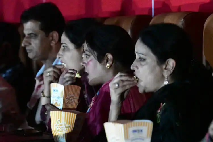 Kashmiri women engrossed in watching the movie in the multiplex in Srinagar Image (Basit Zargar)