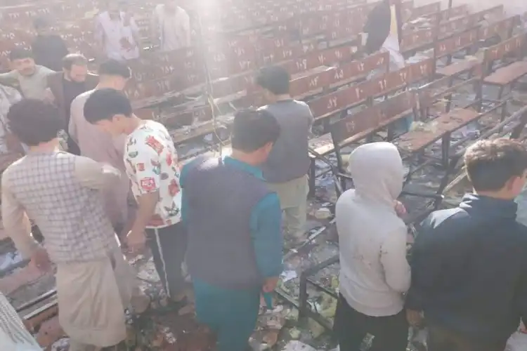 People rummaging through the classroom when suicide bomber struckaiting outside the ward of Kabul hospital