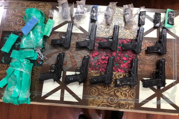 10 foreign made pistols along with eight spare magazines and a mobile phone seized by Punjab Police. 