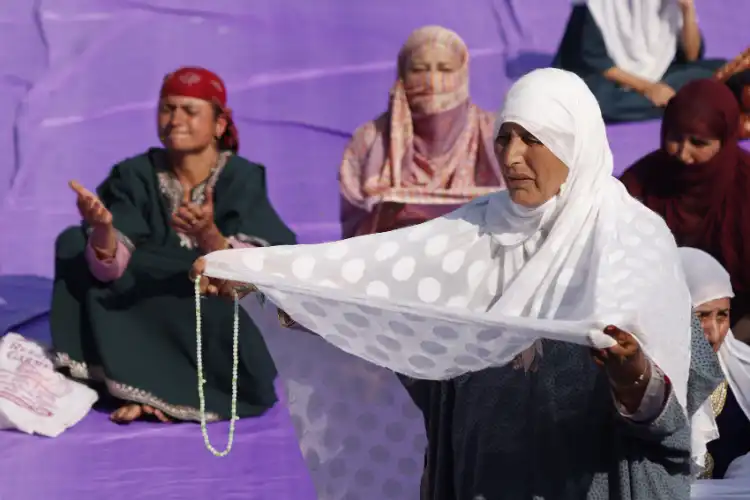 A Kashmiri women seeks blessings and divine bounties at Hazratbal shrine(Pics by Basit Zargar