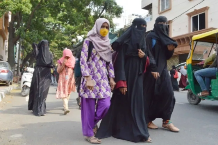 Women crossing a road in India