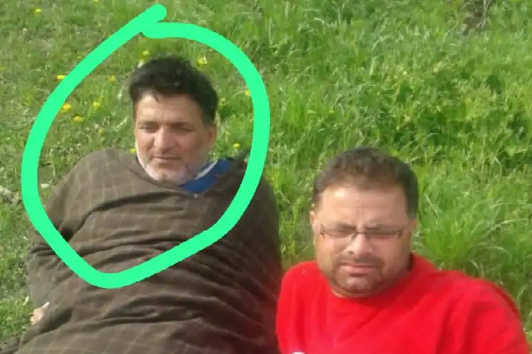 Puran Kishen Bhat (Face encircled) with a familyt member in Kashmir