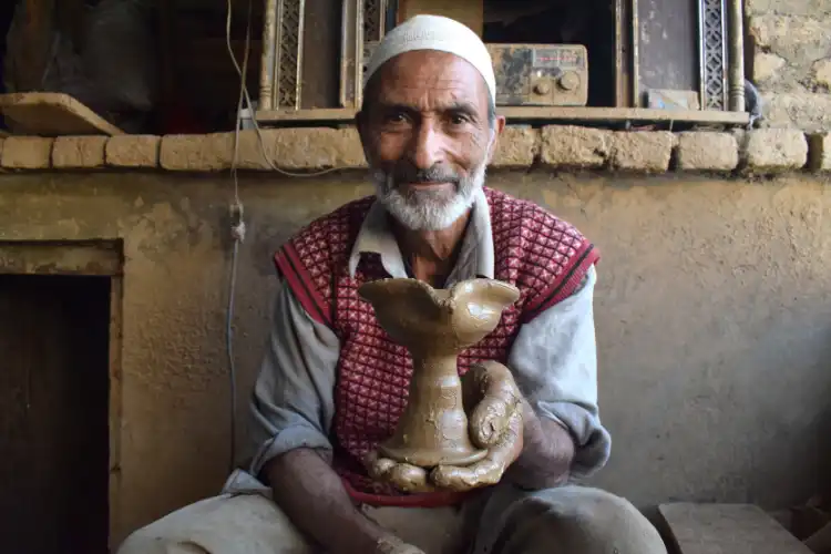 Abdul Salam Kumhar showing off his diyas (Pics: Basit zargar)