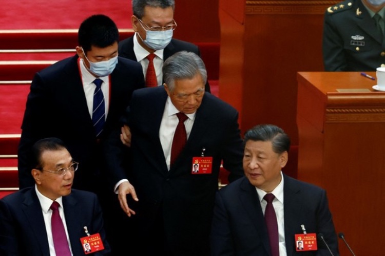 Hu Jinato being escorted out