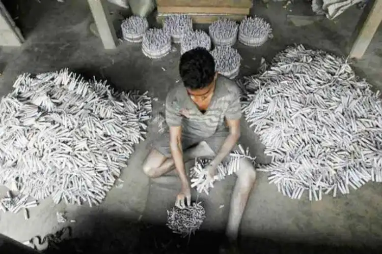 A child making firecrackers in Ghaziabad, UP