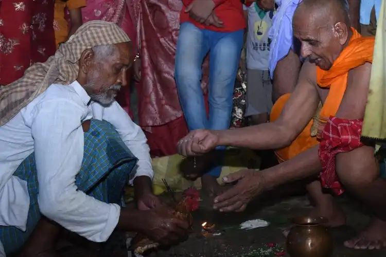 The scene before the sacrifice of a chicken inside the temple