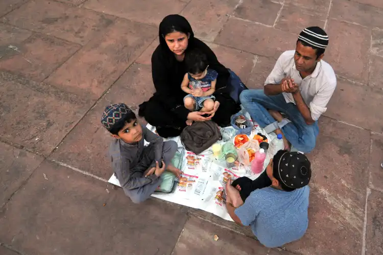 An Indian Muslim Family breaking Ramazan fast at Jama Masjid, Delhi (Image: Ravi Batra)