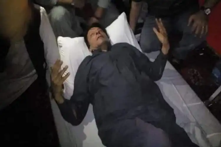 An injured Imran Khan being evacuated to hospital (Courtesy: Twitter)