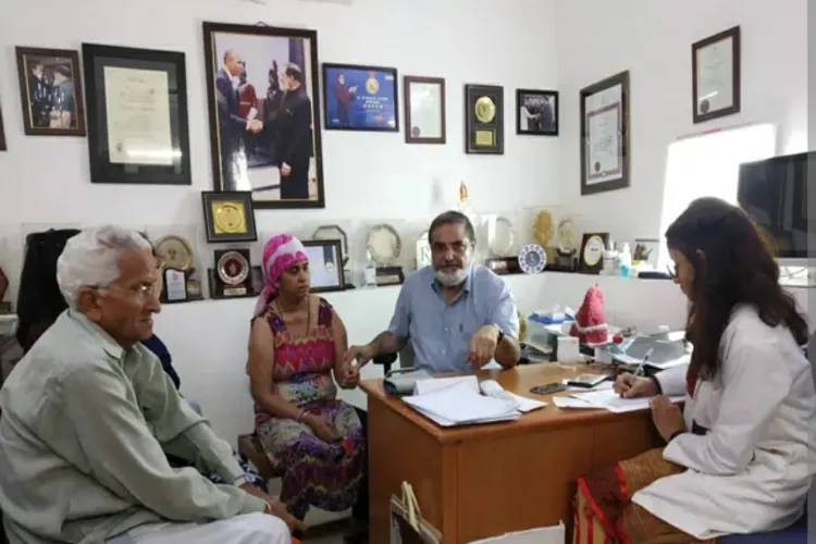 Professor (Dr) Mohsin Wali examining a patient with bronchitis in his clinic