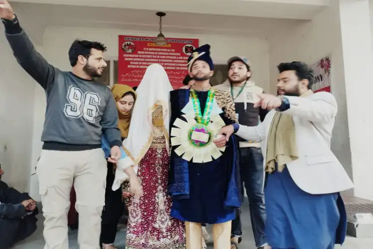 A bride and a groom being blessed at the Helping Hands function