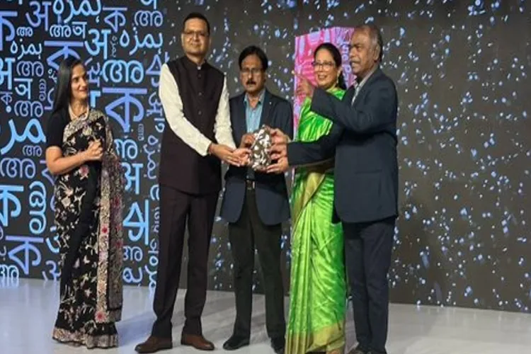 Khalid Javed receiving the JCB literary award for his book