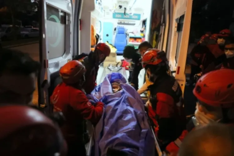 A person injured in the quake being moved to an ambulance