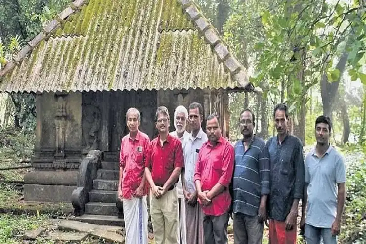 Locals of Therlayi Island in Kerala standing outside the 600-year old Shiva temple