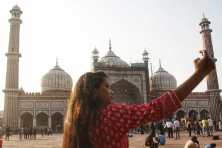 A girl takes a selfie at Jama Masjid