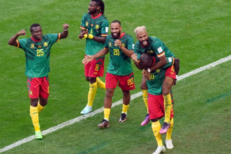 Cameroon players celebrate the equaliser