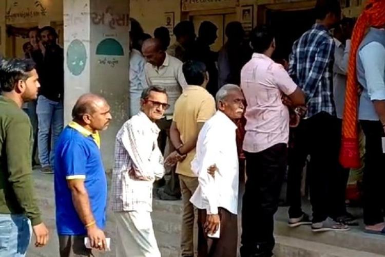 Voters at a polling booth in Gujarat