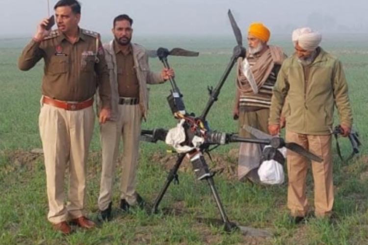Punjab Police personnel with the drone recovered from India-Pak border