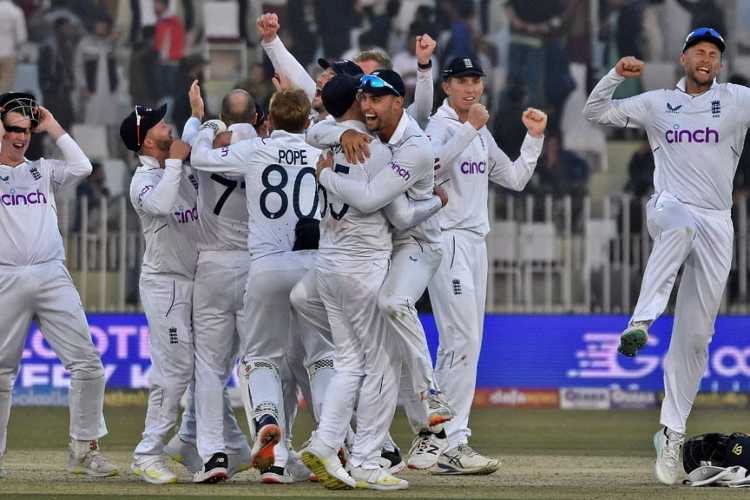England players celebrate their famous 74-run win over Pakistan in the first test match