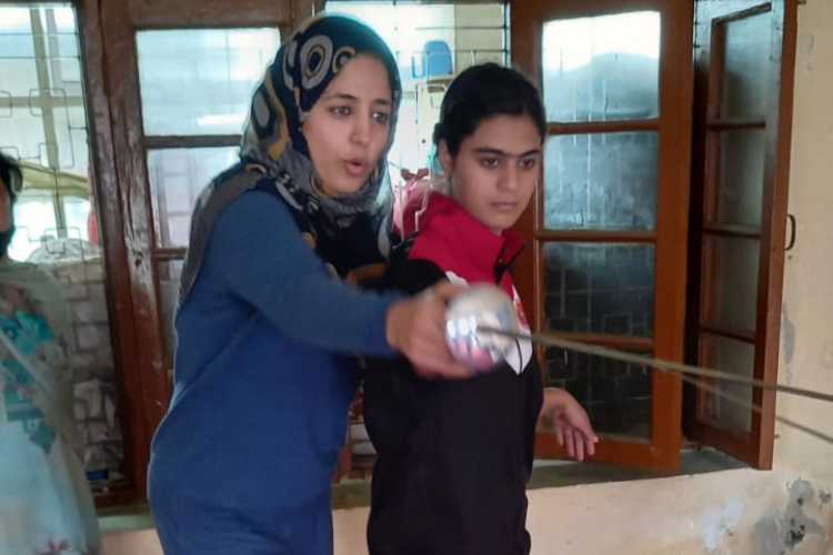 Razia Sultan (Left) training an aspirant