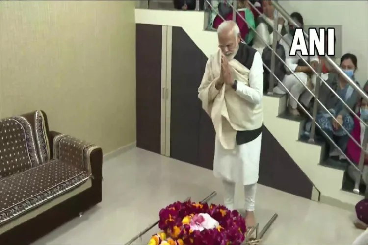 Prime Minister Narendra Modi paying respect to his mother following her demise