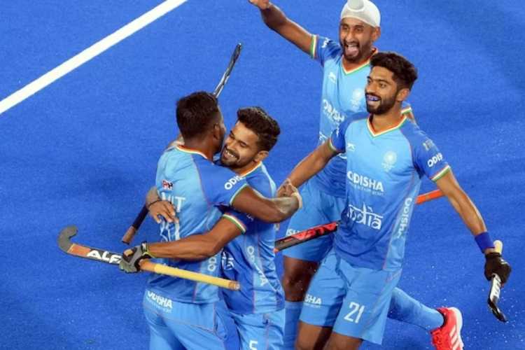 Indian players celebrate the first goal against Spain