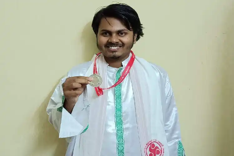 Illias Khan Rana displaying his gold medal