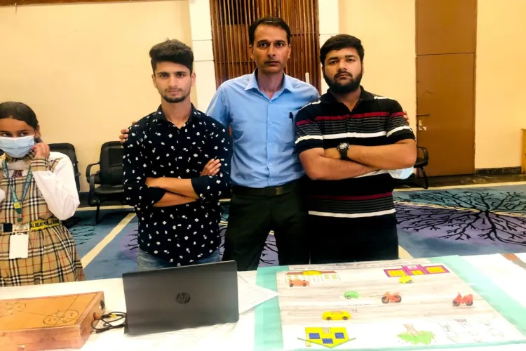 Abid Fayaz and Danish Mushtaq with their teacher