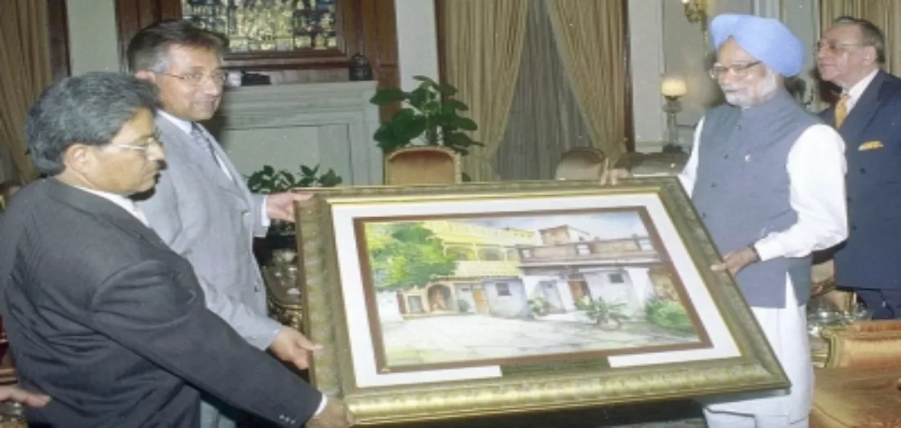 (File photo) Prime Minister Manmohan Singh presenting a painting of the Naharwali Haveli to Pakistan President Musharraf, in New Delhi in April, 2005