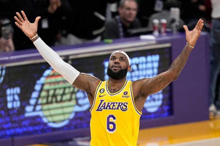 LeBron James celebrates after becoming the highest scorer in the history of NBA